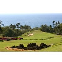 The par-4 first hole on the Emerald Course at Wailea Golf Club plays downhill toward the ocean.