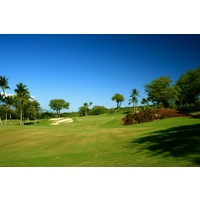 The par-3 third hole on the Gold Course at Wailea Golf Club features lava rock to the right of the green. 