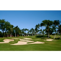 The par-4 ninth hole on the Gold Course at Wailea Golf Club plays uphill toward the clubhouse. 