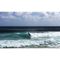 What's Hawaii without surfing? The waves provide the ride at Poipu Beach. 